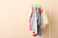 Children clothes on a hanger on a colored background. Royalty Free Stock Photo