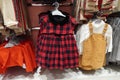 Children clothes hanging on hangers in the shop. A view of colourful kid blouses and shirt hanging on the cloth rack in the shop. Royalty Free Stock Photo