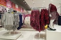 Children clothes hanging on hangers in the shop. A view of colourful kid blouses and shirt hanging on the cloth rack in the shop. Royalty Free Stock Photo