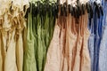 Children clothes summer dresses hanging on hangers in the shop Royalty Free Stock Photo