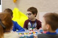 Children collect various objects from plastic parts of the constructor