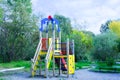 Children colorful entertainment area with slide. Summer afternoon outdoors