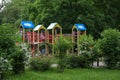 A children Colorful playground on yard in the park. the green grass Royalty Free Stock Photo
