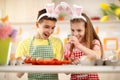 Children coloring eggs for Easter celebration