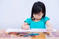 Children are coloring with intent. Child and imaginary creativity through art. Kid learn crafts on paper. Cute girl aged 3-4 years