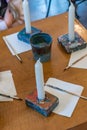 Children colorize a candles with acrylic paints