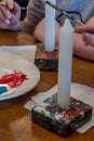 Children colorize candles with acrylic paints