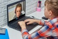 Children communicate via video on a laptop Royalty Free Stock Photo