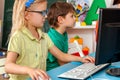 Children computer class us for education and video game. Royalty Free Stock Photo