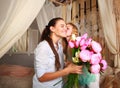 Children congratulate mother give her bouquet of flowers