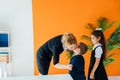 Children congratulating the teacher on the holiday