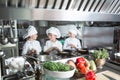 Children cook eggs in the kitchen at the Restaurant.