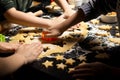 Children cook New Year`s cookies together. Carving Christmas trees and stars out of dough. Preparation for the holiday. Homemade