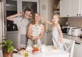 Children cooking making pizza at home. Teen boy and his sisters having fun in the kitchen. People teenagers and leisure concept