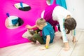 The children are crawling through holes in the fabric Royalty Free Stock Photo