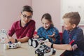 Stem education. Kids creating robots at school