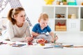 Children creativity. mother and baby son drawing together Royalty Free Stock Photo