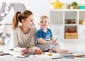 Children creativity. mother and baby son drawing together Royalty Free Stock Photo