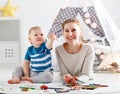 Children creativity. mother and baby son drawing together Royalty Free Stock Photo