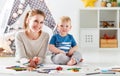 Children creativity. mother and baby son drawing together Royalty Free Stock Photo