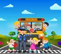 The children cross the road while the police stop the school bus and the children waving