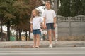 children cross the street at the crosswalk.