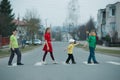 Children crossing street on crosswalk Royalty Free Stock Photo