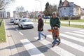 Children crossing street with officer