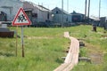 Children crossing warning road sign at rural area Royalty Free Stock Photo