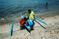 Children are curious of what to see in the small boat