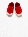 Children cute red small sized canvas shoes top view overhead s Royalty Free Stock Photo