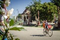 Children cycling at wat svay andet temple gardens in cambodia