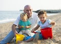 Children with Dad on beach Royalty Free Stock Photo