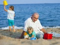 Children with Dad on beach Royalty Free Stock Photo