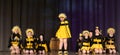 Children dancing in bee costumes