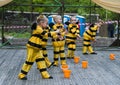 Children dancing in costume bee