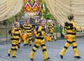 Children dancing in costume bee