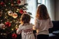 Children decorating the Christmas tree