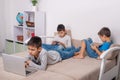 Children of different ages use gadgets for games, communication and for learning.  Modern lifestyle.  Social issue Royalty Free Stock Photo