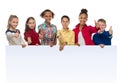 Children of different complexion holding an empty blank with thumbs up Royalty Free Stock Photo
