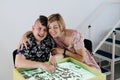 disabled child doing sensory activity with sand, rehabilitation