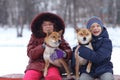 children with dogs at winter park