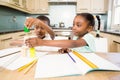 Children doing homework in the kitchen Royalty Free Stock Photo