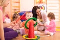 Children doing physical activities with nursery teacher in preschool Royalty Free Stock Photo