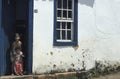 Children at the door of their house in Tiradentes, Minas Gerais, Brazil. Royalty Free Stock Photo