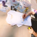 Children draw a map of Ukraine on a T-shirt