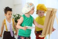 Children draw pictures on an easel