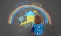 Children draw the Ukrainian flag house on the pavement. Selective focus.