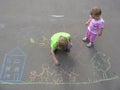 Children drawing on asphalt