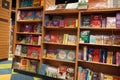 Children drawing and coloring books on shelves in a bookstore for sale. Library kids books section. Variety of Books For Sale On